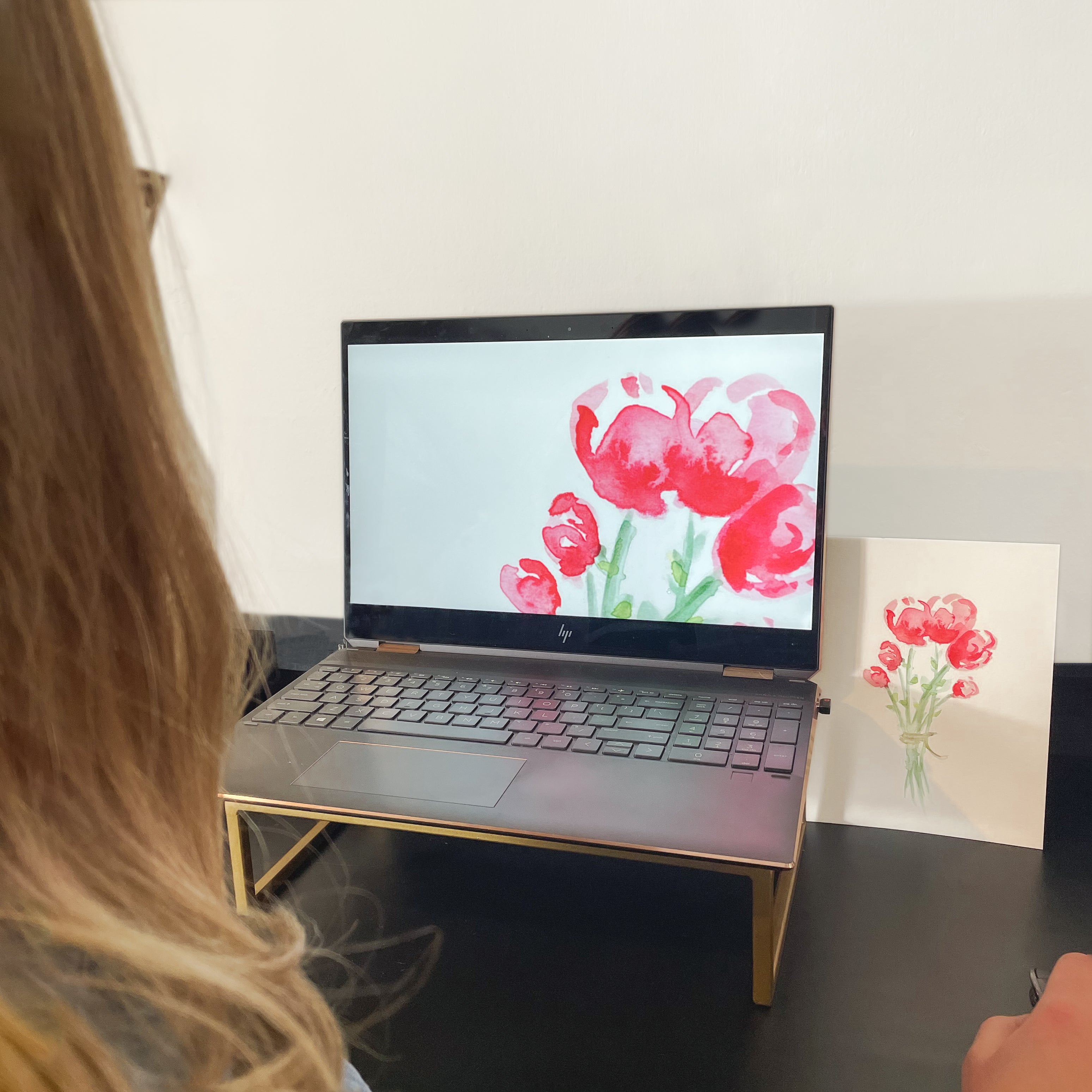 Computer screen with image of floral art in the editing process